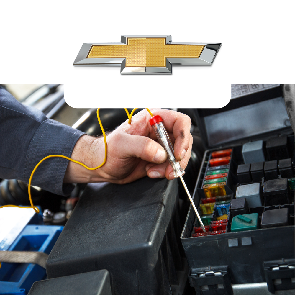 Person working on a car's fuse box with a Chevrolet logo above