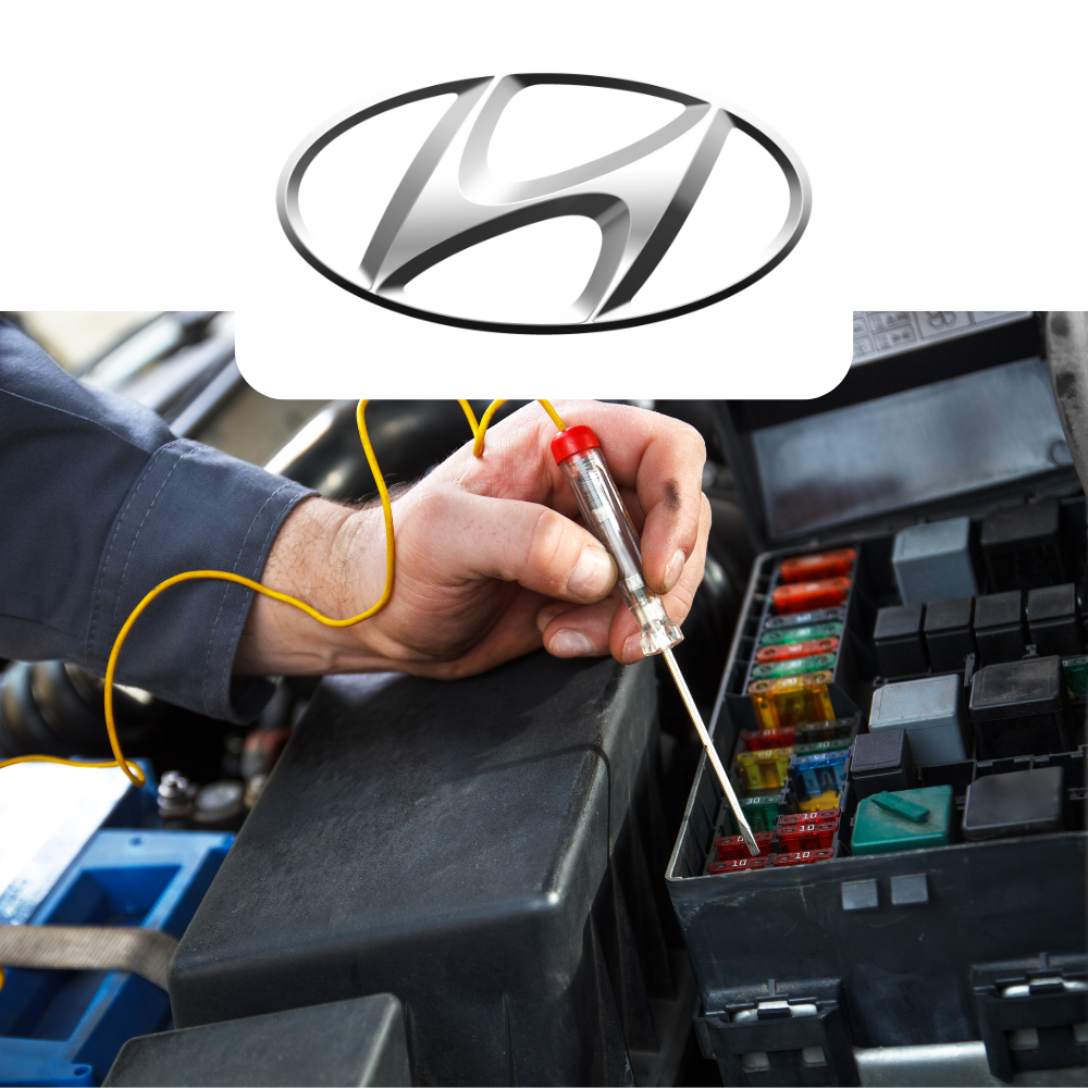Person working on a car's fuse box with Hyundai logo above
