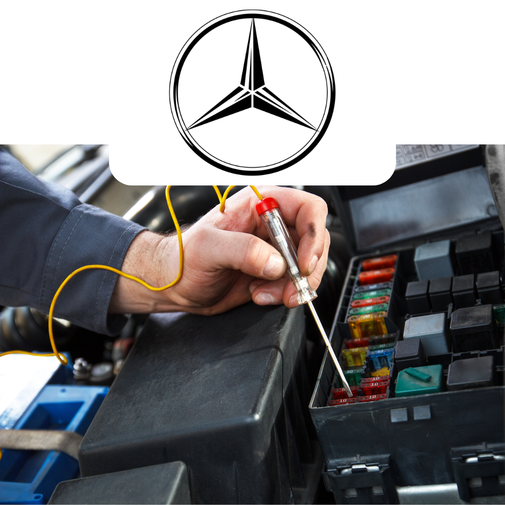 Person working on car electrical system with Mercedes-Benz logo above