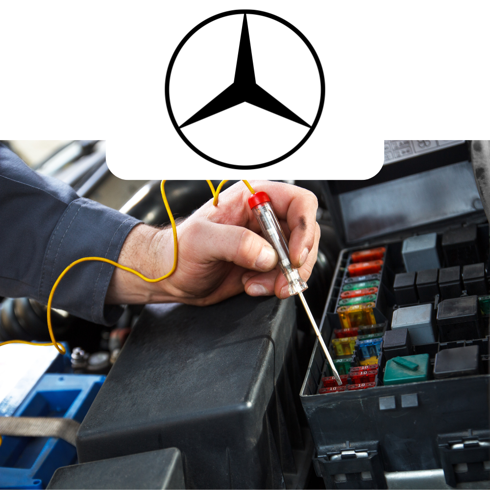 Person working on car electrical system with Mercedes-Benz logo above