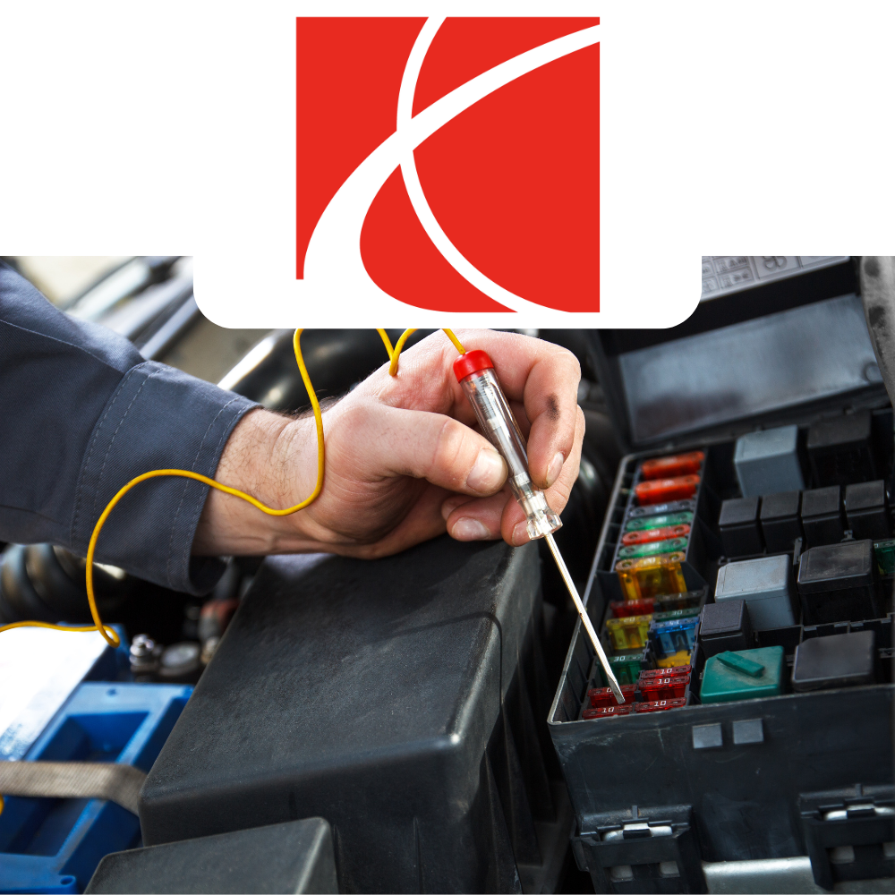 Person working on a car's fuse box with Saturn logo above