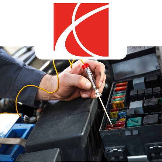 Person working on a car's fuse box with Saturn logo above