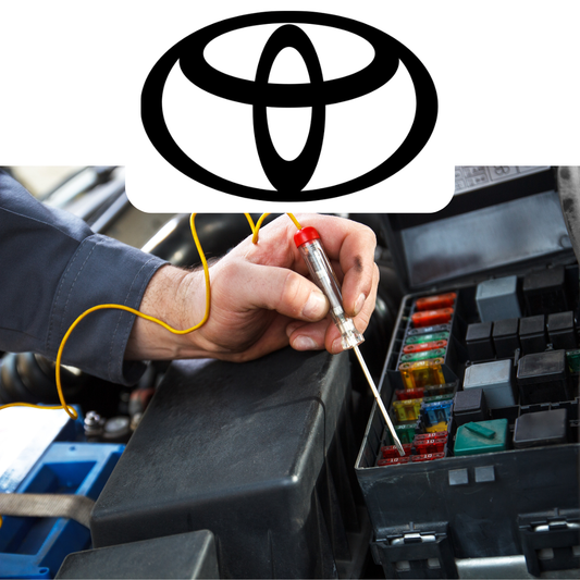 Person working on a car's fuse box with a Toyota logo above